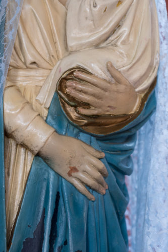 Close up of the Virgin Mary statue inside St May's Church, Somers Town - Photograph by Michael Hall